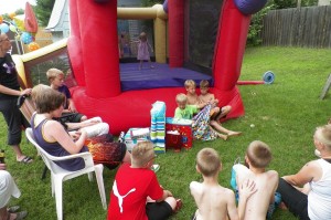 Check out sneaky Echo in the bouncy castle during gift opening. If other kids were in it it was just too much for her.