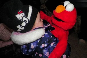 Hugging the Elmo... a Christmas present from Gammie.