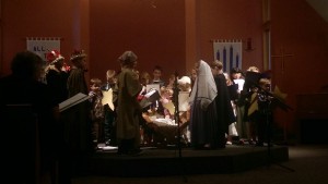 Singing around Baby Jesus.