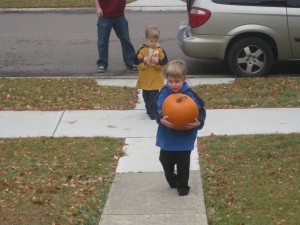 Zander Carrying 1 of 3 Pumpkins
