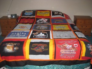 Our Bed - the Quilt was made by mom out of old Harley Davidson T-shirts!